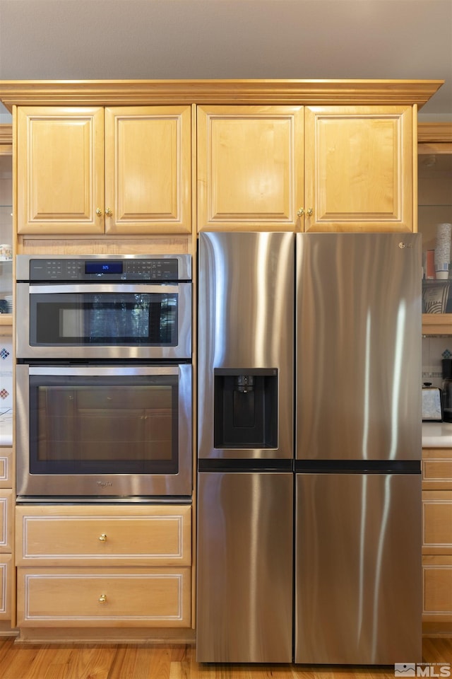 kitchen featuring appliances with stainless steel finishes and light brown cabinets