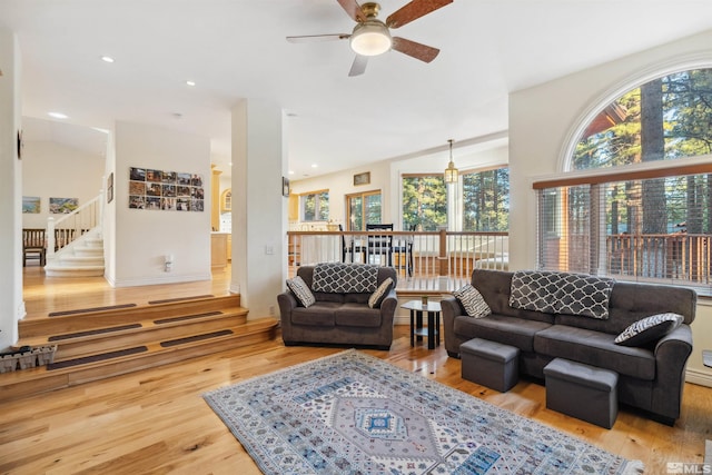 living room featuring hardwood / wood-style flooring and ceiling fan