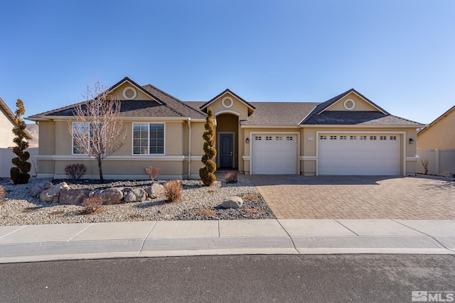 ranch-style home featuring a garage