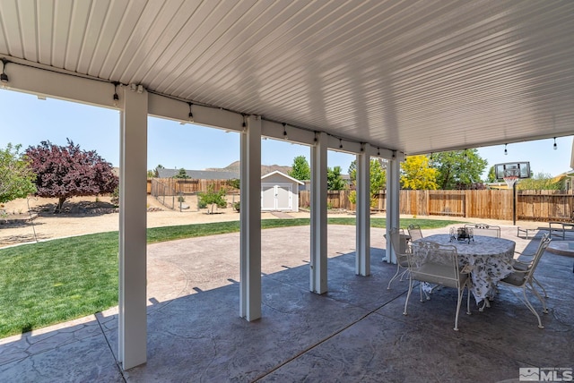 view of patio / terrace with a storage unit