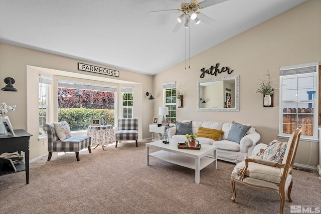 living room featuring carpet floors, vaulted ceiling, and ceiling fan