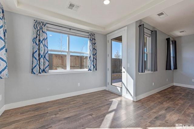 empty room featuring dark wood-type flooring