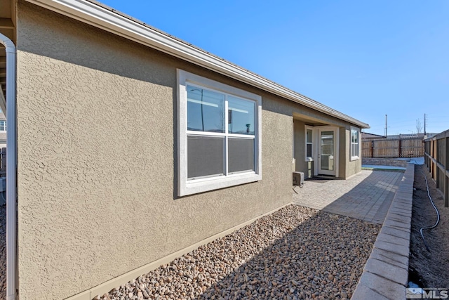 view of property exterior featuring a patio