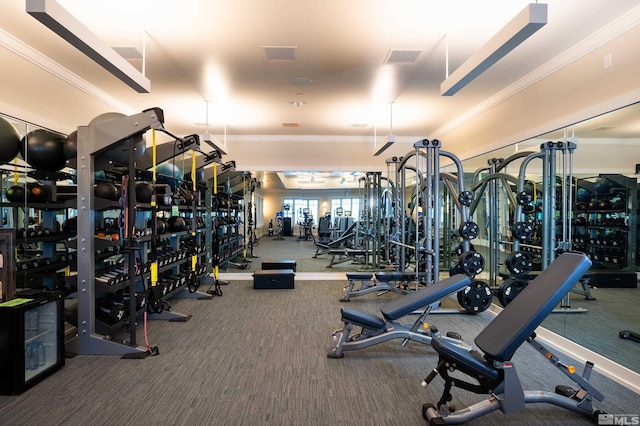 workout area featuring ornamental molding