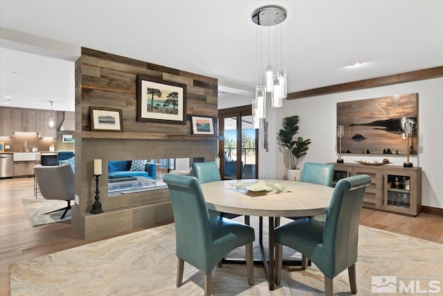 dining area with light wood-type flooring