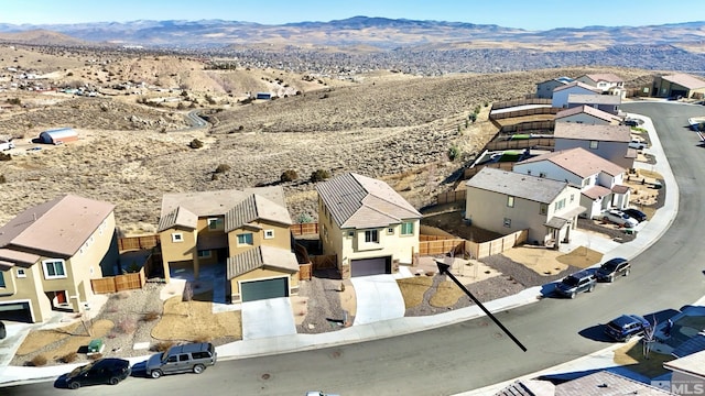 birds eye view of property with a mountain view