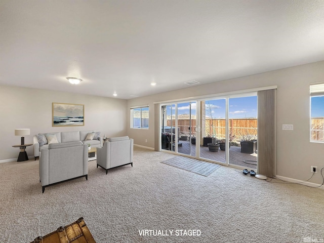 living room featuring light carpet