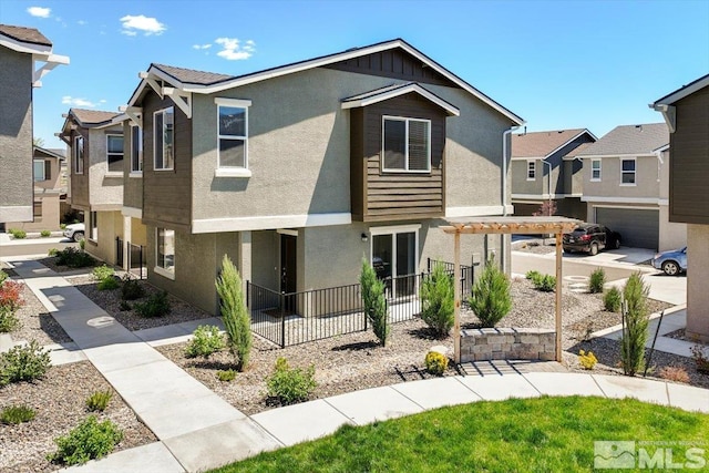 view of front of property with a pergola