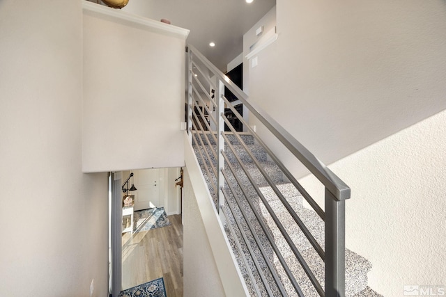 stairway featuring hardwood / wood-style flooring