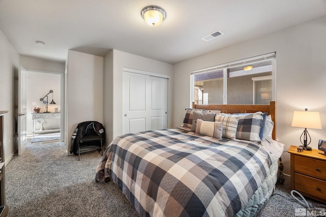 bedroom with carpet and a closet