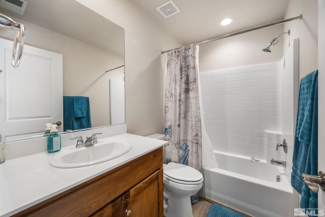 full bathroom with vanity, toilet, and shower / bath combo with shower curtain