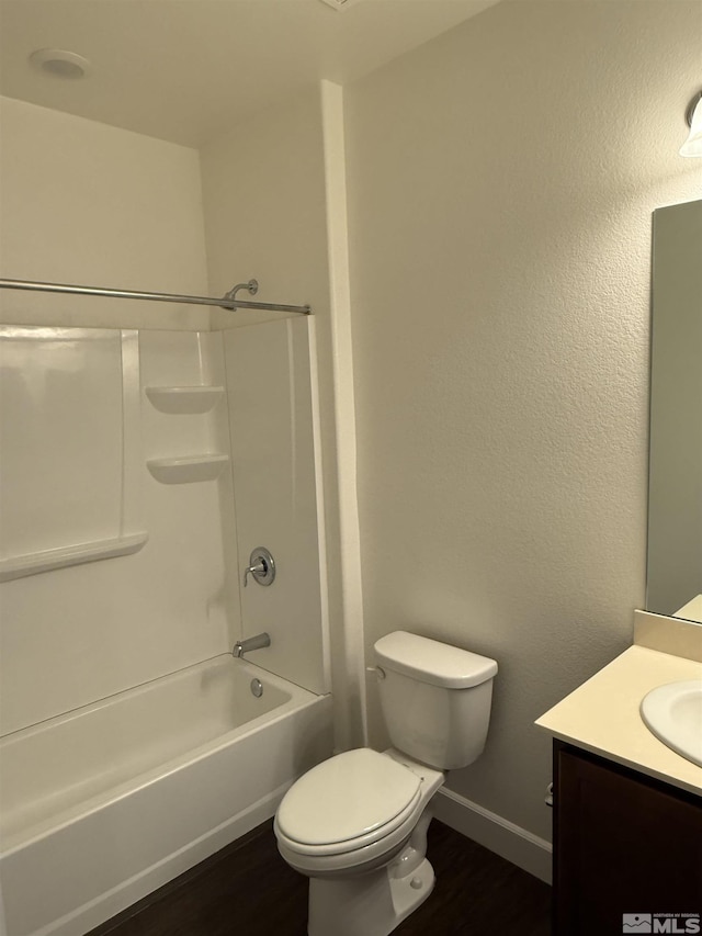 full bathroom with hardwood / wood-style flooring, shower / tub combination, vanity, and toilet