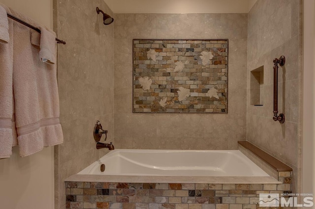 bathroom with tiled shower / bath combo