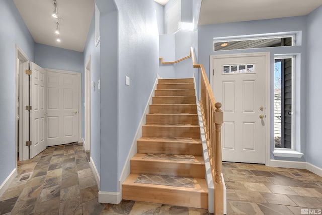 entrance foyer featuring track lighting