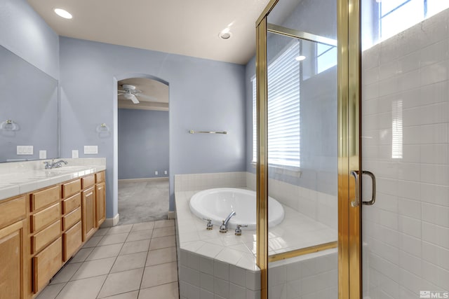 bathroom with vanity, tile patterned floors, independent shower and bath, and ceiling fan