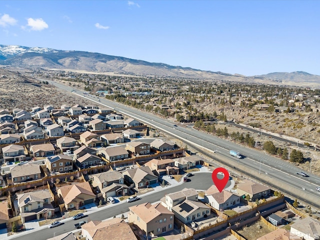 birds eye view of property with a mountain view