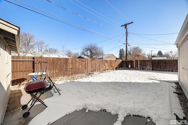 view of yard covered in snow