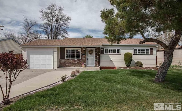 single story home featuring a garage and a front yard