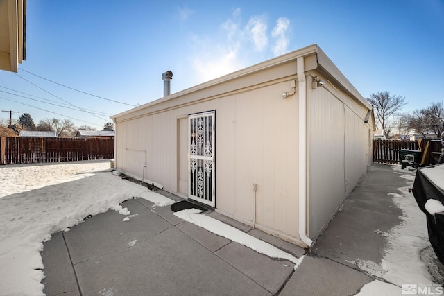 view of side of property with a patio