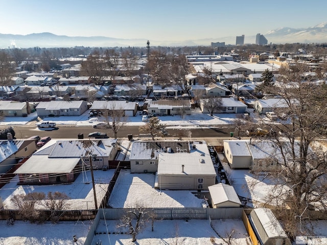 snowy aerial view featuring a mountain view