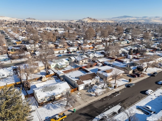 snowy aerial view with a mountain view