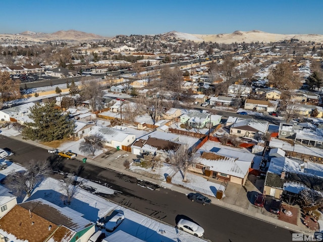 snowy aerial view featuring a mountain view