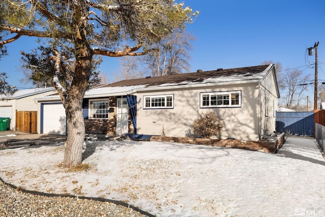 single story home with a garage