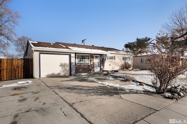 ranch-style home featuring a garage