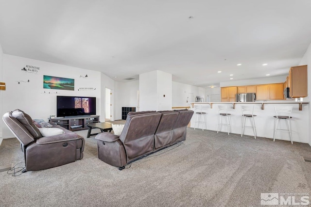 living room featuring light colored carpet