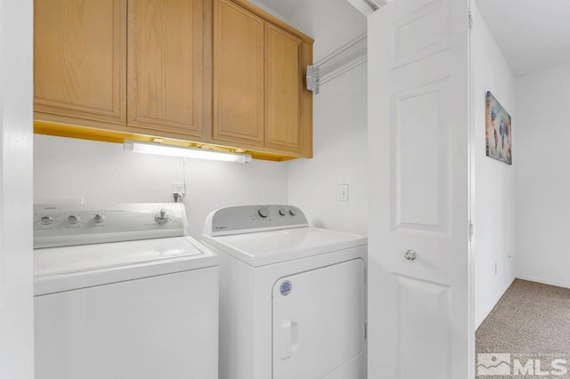 laundry room with cabinets, washer and clothes dryer, and carpet floors