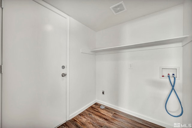 laundry room featuring washer hookup, hardwood / wood-style flooring, and hookup for an electric dryer