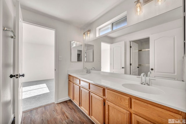 bathroom with vanity and hardwood / wood-style floors