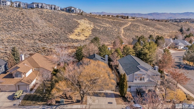 drone / aerial view featuring a mountain view