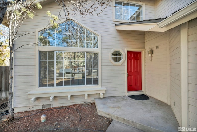 doorway to property with a patio area