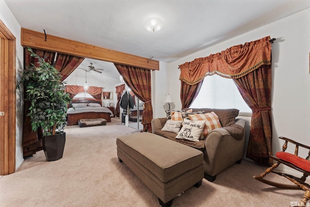 carpeted bedroom featuring beamed ceiling