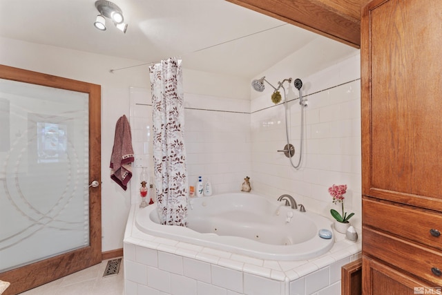 bathroom with shower / bathtub combination with curtain and tile patterned floors