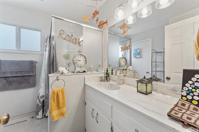 bathroom featuring vanity and tile patterned flooring