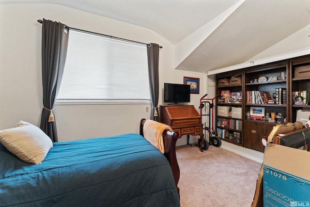 carpeted bedroom featuring lofted ceiling