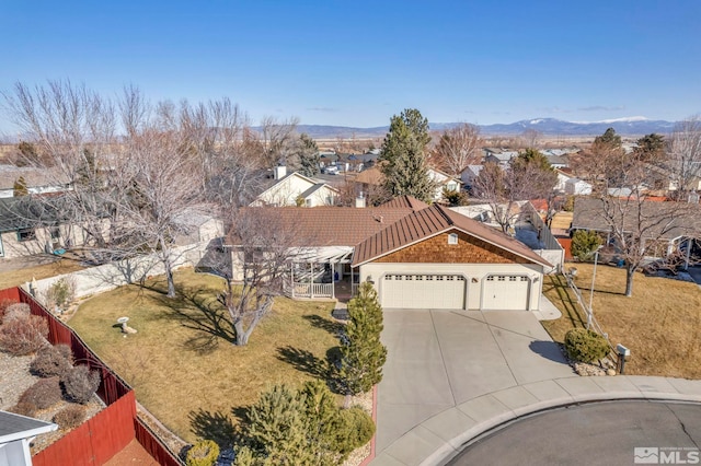 birds eye view of property with a mountain view