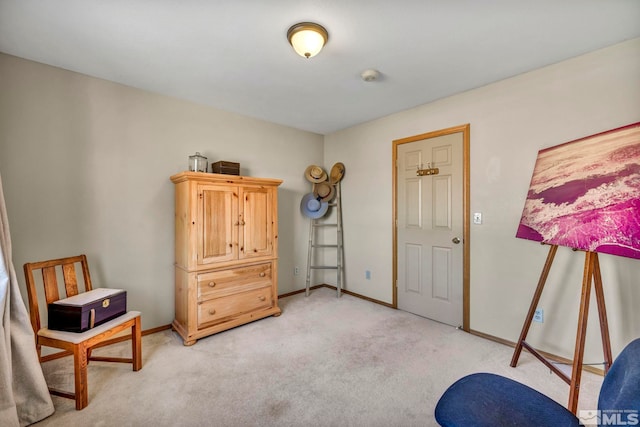 living area featuring light carpet