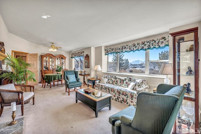 carpeted living room with ceiling fan