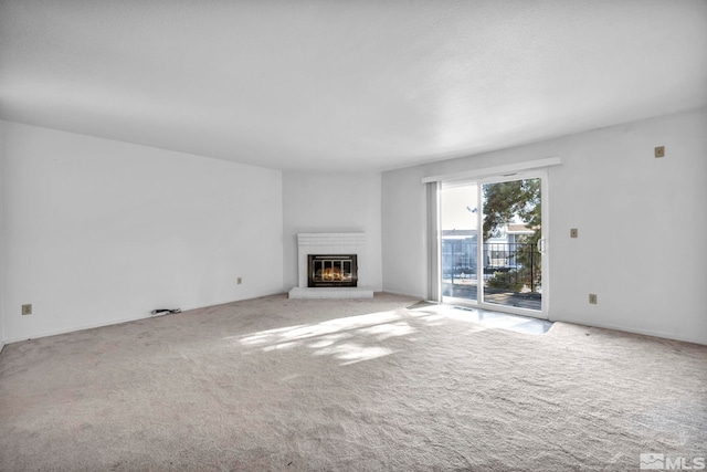 unfurnished living room featuring light carpet