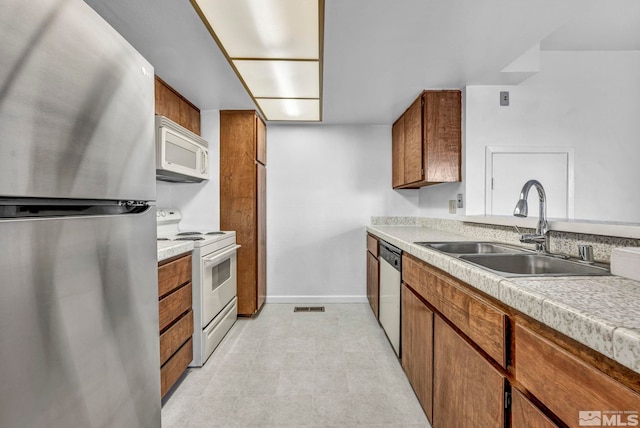 kitchen with sink and appliances with stainless steel finishes