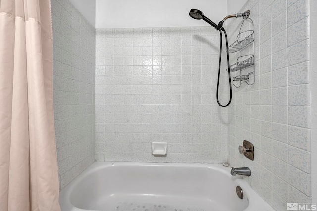 bathroom with shower / bath combination with curtain