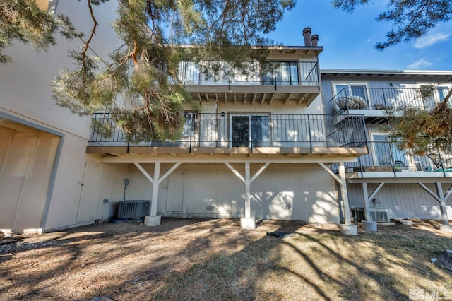 rear view of property with central air condition unit