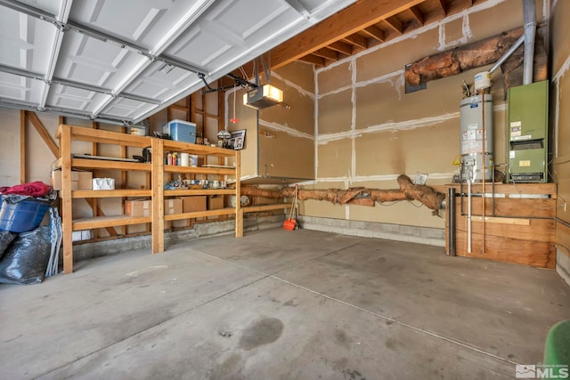 garage featuring a garage door opener, heating unit, and secured water heater