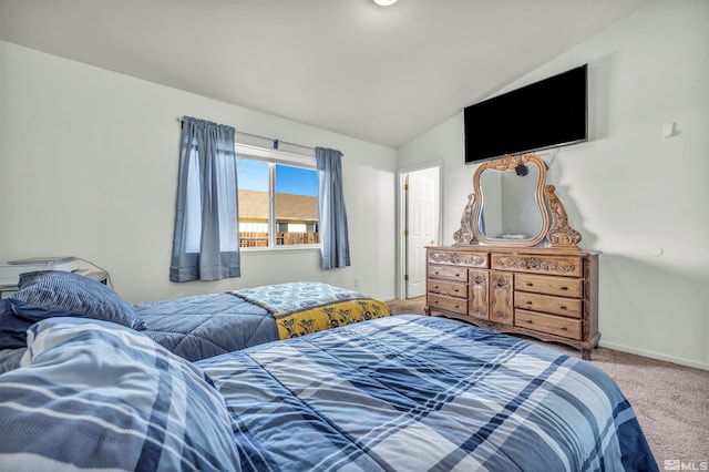 bedroom with lofted ceiling and carpet