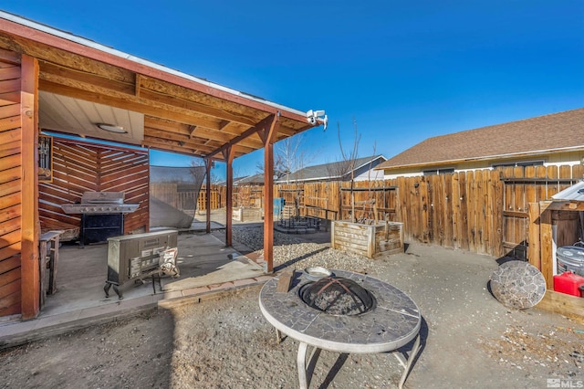 view of patio / terrace featuring a fire pit and grilling area