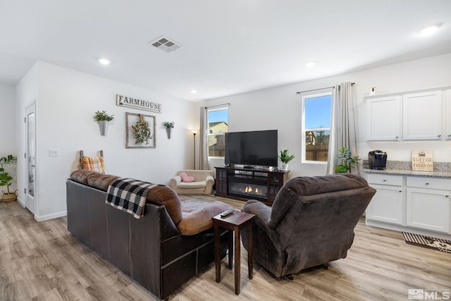 living room with light hardwood / wood-style floors