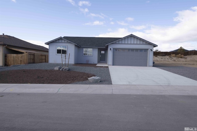 ranch-style house featuring a garage